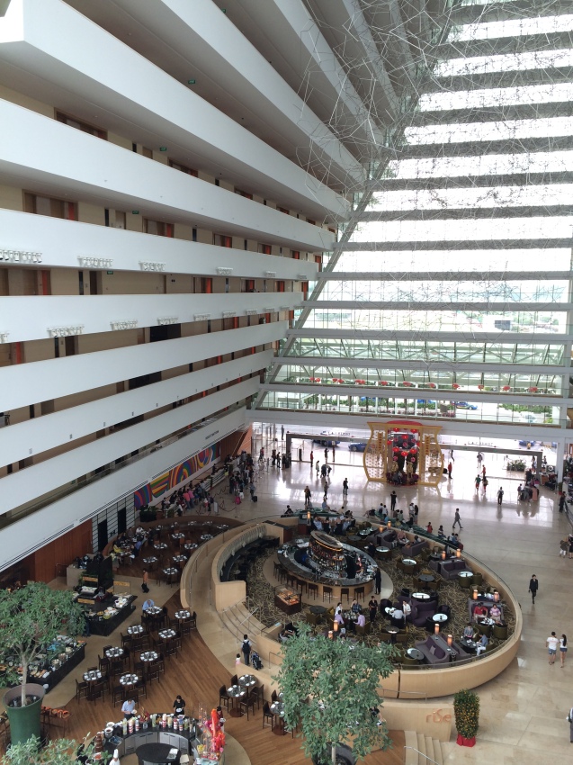 A view of a part of the Marina Bay Sands hotel lobby from above.